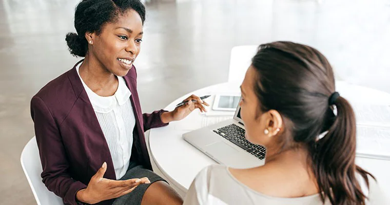 Two women having a business meeting at a desk