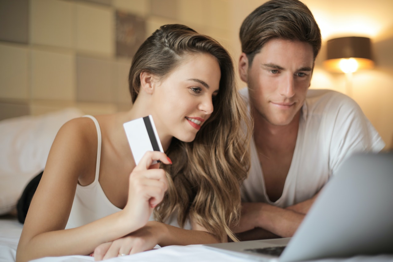 Man and woman working together on their laptops